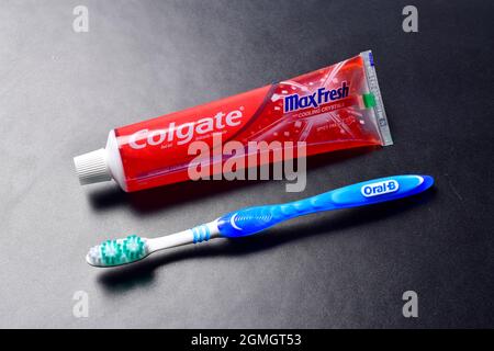 New Delhi, Indian, 12 November 2019:- Colgate Toothpaste with Toothbrush on dark background Stock Photo
