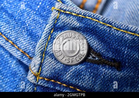 New Delhi, India - 22 November, 2019: top view of blue levis jeans button, close up Stock Photo
