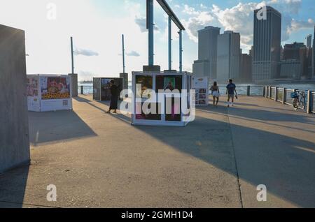 Brooklyn, United States. 18th Sep, 2021. The Annual Photo Festival, Photoville returned to New York City. An art exhibit is on display in Brooklyn Bridge park on September 18, 2021. (Photo by Ryan Rahman/Pacific Press) Credit: Pacific Press Media Production Corp./Alamy Live News Stock Photo