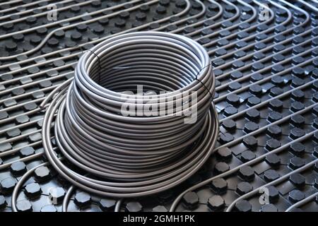 Underfloor surface heating and cooling pipes. Stock Photo