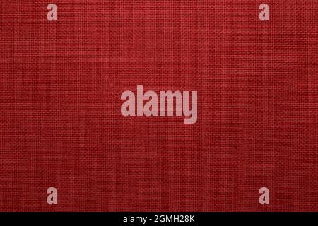 Red linen canvas texture, scarlet textile fabric background Stock Photo