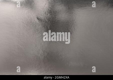 Textured metallic silver background with light and dark highlights, bright and shiny reflective foil metal texture Stock Photo