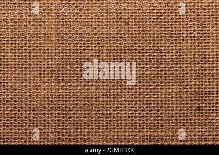 Close-up burlap sack textured background; brown, rustic, woven cloth texture Stock Photo