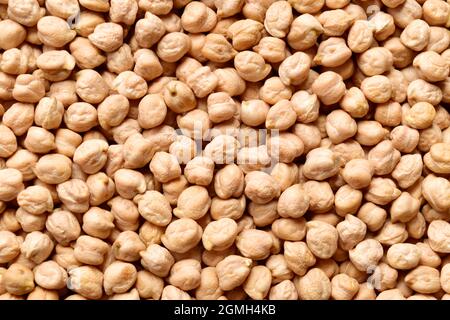 Raw chickpeas textured background, top view of  uncooked chickpeas Stock Photo