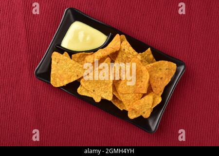 Top View of Nachos with Mustard dip in Plate Stock Photo