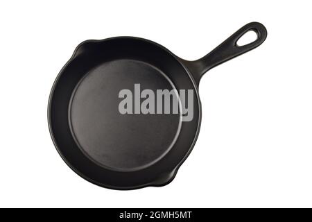 Cast iron pan over white background with clipping path, top view of empty cast iron skillet Stock Photo