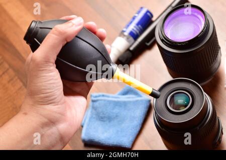 lens cleaning from air blower Stock Photo