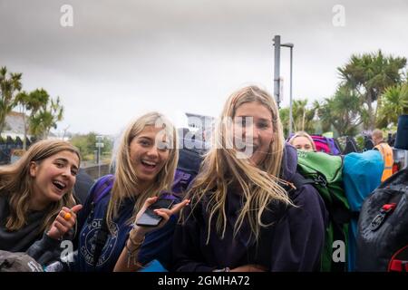 A group of excited young girls arriving at Newquay Train Station for the Boardmasters Festival in Cornwall. Stock Photo