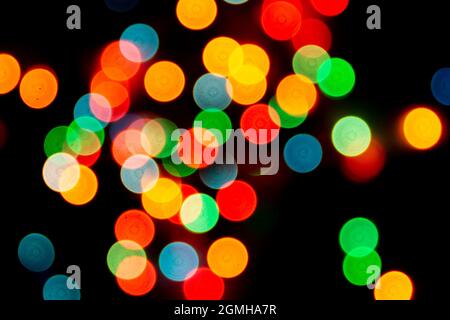 blurred defocused christmas lights bokeh on a black background Stock Photo