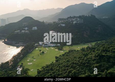 Houses on the hillside above Hong Kong Golf Club, Deep Water Bay, viewed from a highrise apartment in Repulse Bay Road, Hong Kong Island, in 2009 Stock Photo
