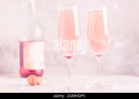 Champagne or wine in glasses on light background. Copy space. Stock Photo