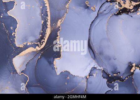 Luxury abstract fluid art painting background alcohol ink technique Blue and gold. Stock Photo