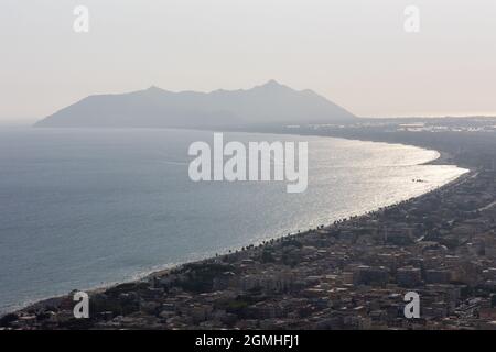 Terracina, Italy - august 19 2021 - Aerial view of city Terracina on bright sunny day. Circeo promontory and Tyrrhenian sea on background Stock Photo