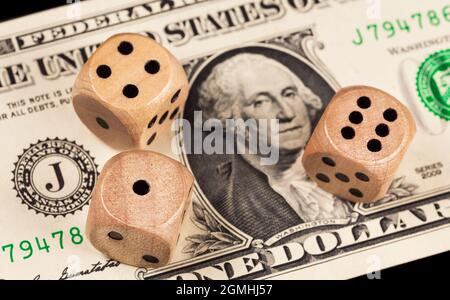 Dice on the background of a one dollar bill Stock Photo