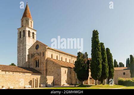 View of the ancient Basilica di Santa Maria Assunta in Aquileia against a blue sky Stock Photo