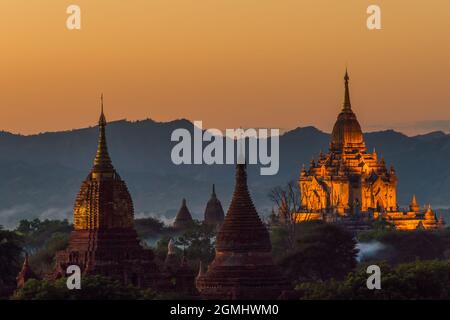 View over the temples of Bagan in Myanmar to the surrounding mountains at sunset
