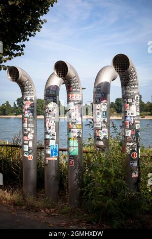ventilation pipes on the banks of the Rhine covered with many stickers, Cologne, Germany.  mit vielen Aufklebern beklebte Lueftungsrohre am Rheinufer, Stock Photo
