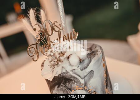 Wedding cake with flowers on background, close up Stock Photo
