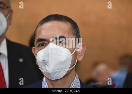 17 September 2021, North Rhine-Westphalia, Cologne: Physician Ugur Sahin in Maske near Cologne honors the Biontech founders in the town hall. The two researchers sign the city's Golden Book and the University of Cologne awards them an honorary doctorate. Photo: Horst Galuschka/dpa Stock Photo