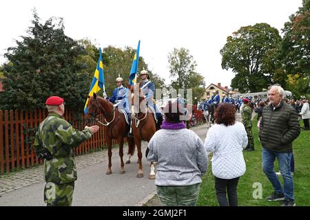 Linköping, Sweden. 19th, September, 2021. The Royal Swedish Cavalry Band with horses from the Association for the Mounted Guard conducts a riding parade through Linköping city on Sunday. The Royal Swedish Cavalry Band is one of three professional military bands in the Swedish Armed Forces. The band traces its ancestry back to the 1500s when King Gustav Vasa raised his first regiment of horse. Today the Royal Swedish Cavalry Band is one of few mounted bands in the world. Credit: Jeppe Gustafsson/Alamy Live News Stock Photo