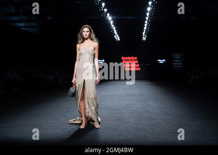 A model walks the runway at the  Goodption fashion show during the Mercedes Benz Fashion Week Madrid (MBFWM) at IFEMA. Stock Photo