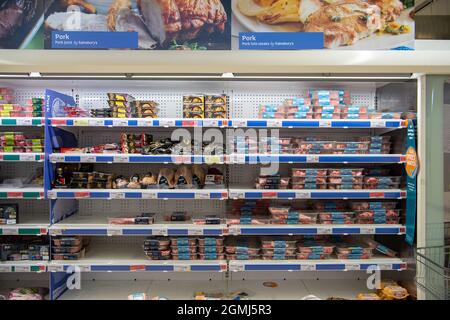 Taplow, UK. 19th September, 2021. The meat isle including pork. Sainsbury's Supermarket had a good supply of food in their store today. Some lines are still being impacted upon by supply chain issues including bottled water and carbonated drinks such as cola due a shortage of carbon dioxide. This may lead to meat running short in supermarkets as animals are stunned before being slaughtered using carbon dioxide. Credit: Maureen McLean/Alamy Live News Stock Photo