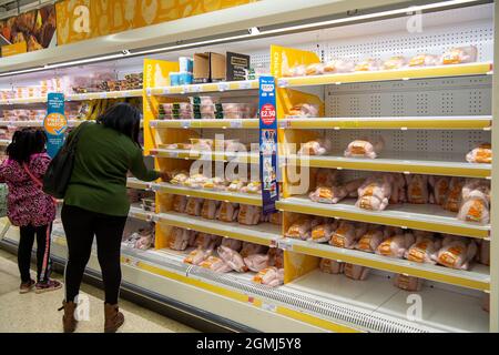 Taplow, UK. 19th September, 2021. Shoppers in the meat isle. Sainsbury's Supermarket had a good supply of food in their store today. Some lines are still being impacted upon by supply chain issues including bottled water and carbonated drinks such as cola due a shortage of carbon dioxide. This may lead to meat running short in supermarkets as animals are stunned before being slaughtered using carbon dioxide. Credit: Maureen McLean/Alamy Live News Stock Photo