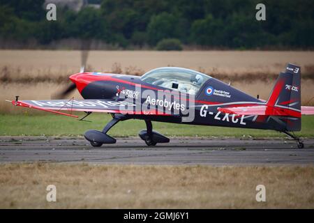 The Blades Extra 300 G-ZXCL taxiing at the Abingdon Air & Country Show 2021 Stock Photo