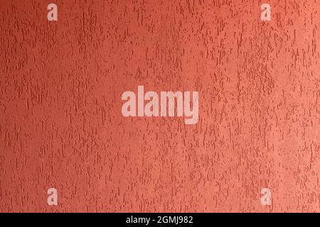 Surface of wall with decorative red plaster Stock Photo