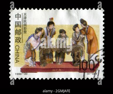 Stamp printed in China shows image of the 1996-30 Folk Painted Sculptures in Tianjin Area, circa 1996. Stock Photo