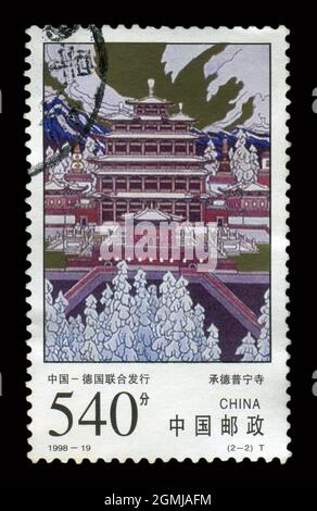 Stamp printed in China shows image of the 1998-19 Puning Temple in Chengde, circa 1998. Stock Photo