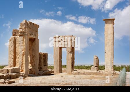 Fabulous view of ruins of the Hadish Palace (the Palace of Xerxes) on blue sky background in Persepolis, Iran. Ancient Persian city. Persepolis is a p Stock Photo
