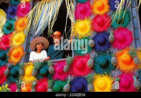 Philippines. Quezon. Rice Harvest Festival. Young Filipinos man and woman standing in window. Stock Photo