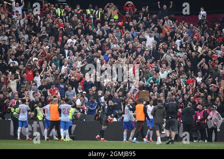 Manchester Utd goalkeeper David De Gea (c) waves to Manchester Utd fans at end of game after he saved a last minute penalty. Premier League match, West Ham Utd v Manchester Utd at the London Stadium, Queen Elizabeth Olympic Park in London on Sunday 19th September 2021. this image may only be used for Editorial purposes. Editorial use only, license required for commercial use. No use in betting, games or a single club/league/player publications. pic by Andrew Orchard/Andrew Orchard sports photography/Alamy Live news Stock Photo