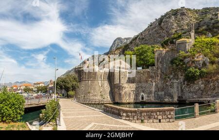 Gurdic tower medieval fortress walls with mountains in the background, Kotor Bay, Montenegro Stock Photo