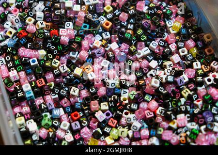 Close up of beads with colorful letters Stock Photo