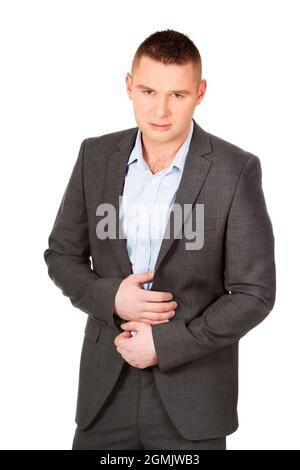 A young man wearing a suit and posing on a white background Stock Photo