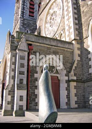 A bronze statue of a monk stands outside the Christchurch Cathedral in Cathedral Square, Christchurch, New Zealand on September 15, 2004. Stock Photo