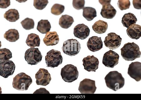 macro image of black peppercorn isolated on white background Stock Photo