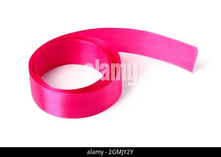 Pink silk ribbon wound in roll isolated on white Stock Photo