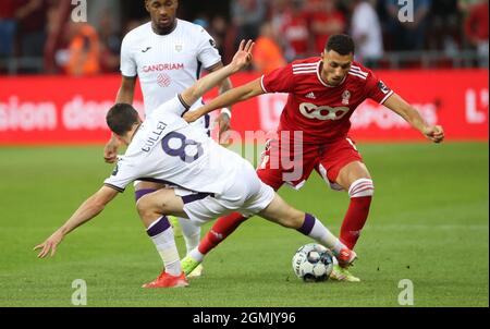 OHL's Xavier Mercier and Anderlecht's Josh Cullen fight for the