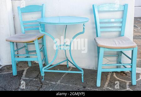 typical table and chair setting found on the Greek Islands Stock Photo