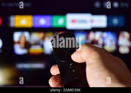 Changing Channel, Hand Holding Remote Controller Stock Photo
