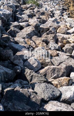 Rough piled stones close-up. Stony surface Stock Photo