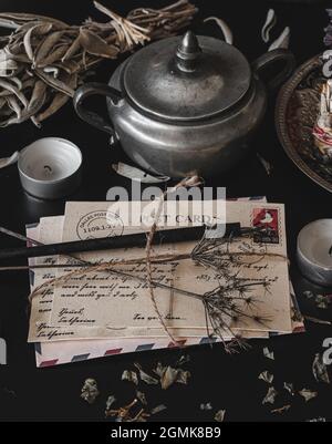 Old vintage looking bundle of postcards hand written in cursive on a ...
