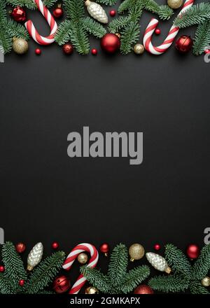 Frame of Christmas tree ornaments on a black background. Festive design with place for text Stock Photo