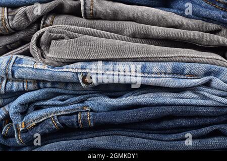 close up different color folded jeans, jeans texture background Stock Photo