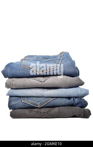 Stack of Denim Jeans Isolated on White Background with Clipping Path Stock Photo