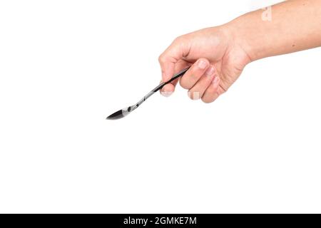 Hand Holding Plastic Spoon Isolated on White Background With Clipping Path Stock Photo