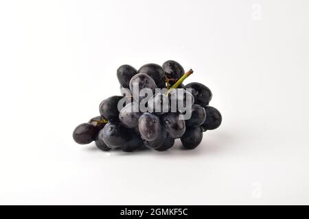 Bunch of black grapes isolated on white background Stock Photo